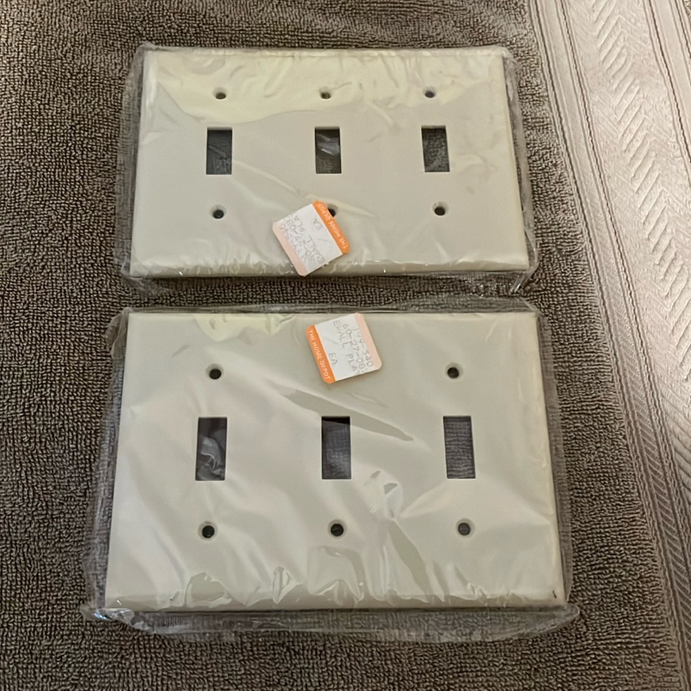 Three switch switch plate made in USA brand new cream color with screws plastic